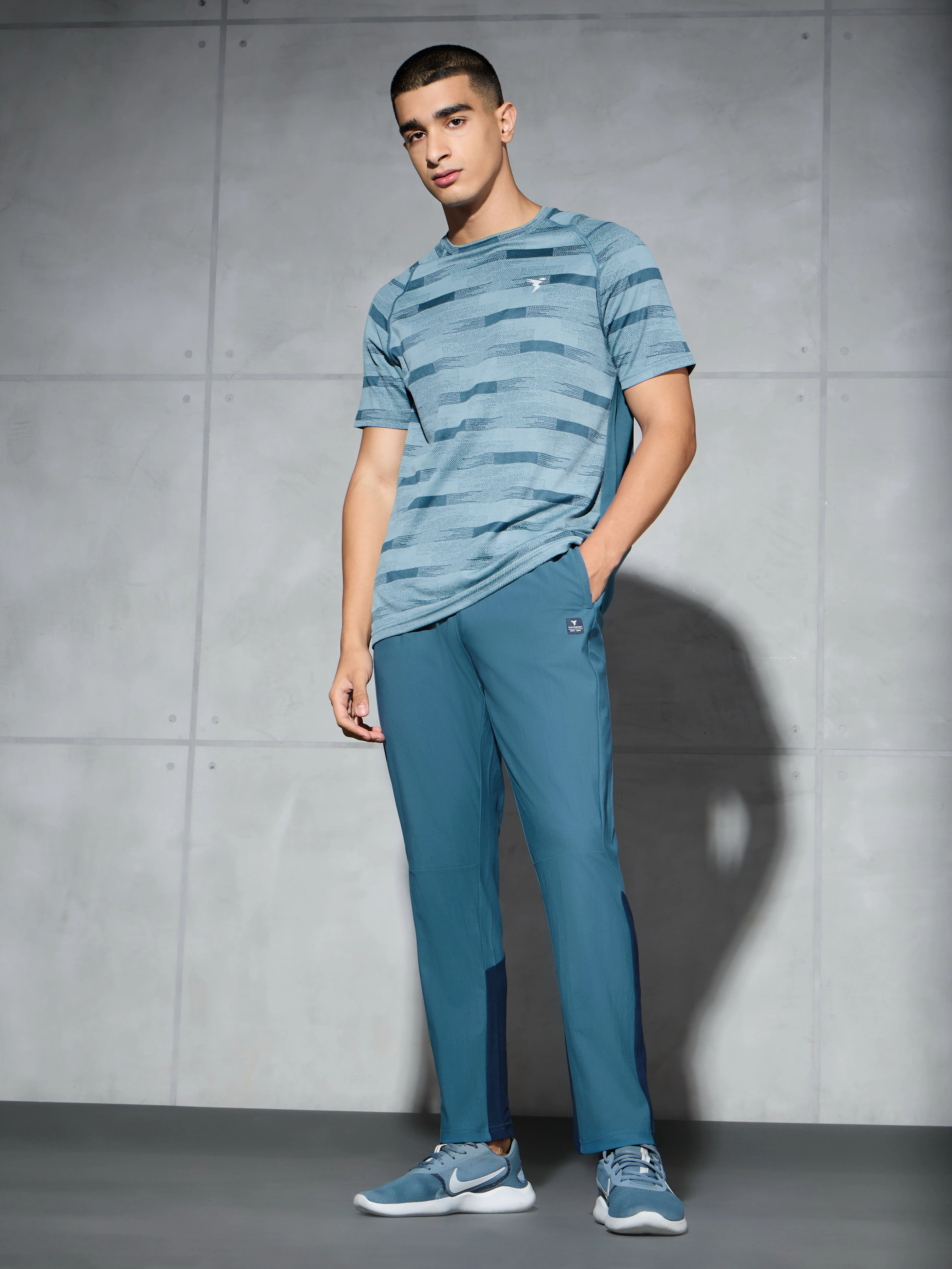Men Solid Straight Fit Sports Trackpants with DURACOOL+ - Image 5