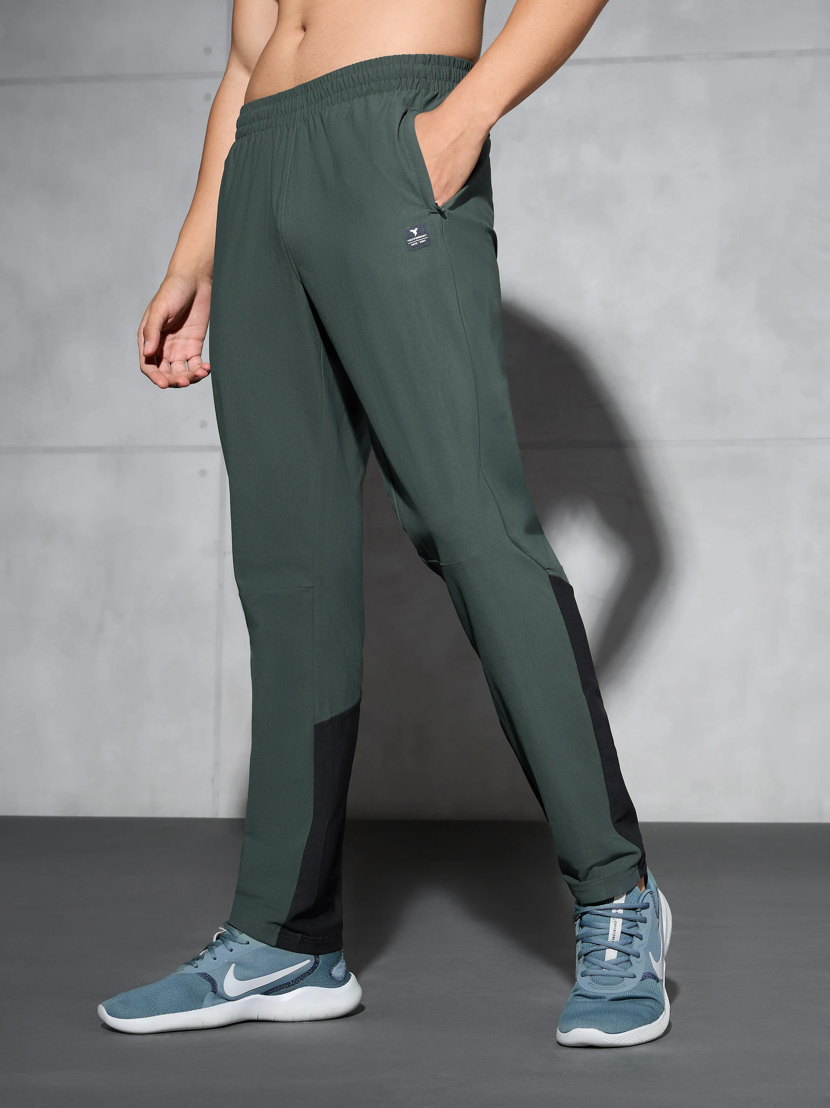 Men Solid Straight Fit Sports Trackpants with DURACOOL+ - Image 4