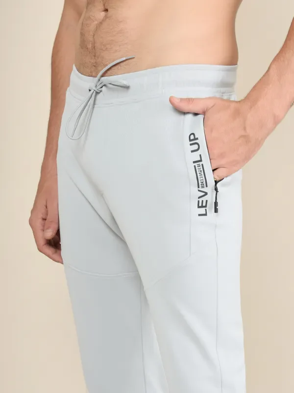 Men Solid Slim Fit Trackpants with TECHNO DRY - Image 6